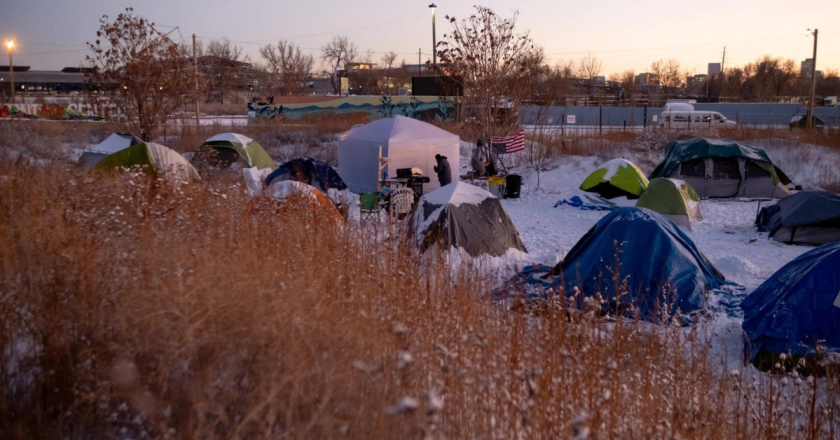 On a dead-end street in north Denver, migrants are surviving winter with the help of an army of volunteers