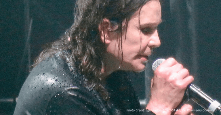 Ozzy Osbourne raises his arms onstage during his 2017 farewell tour