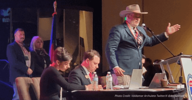 Richard Holtorf speaks at Colorado GOP March 2025 assembly in cowboy hat and suit