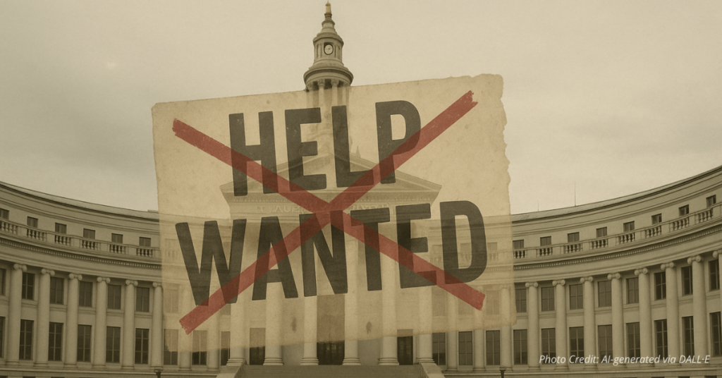 Denver City Hall with crossed-out Help Wanted sign showing layoffs
