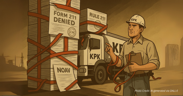 KPK worker facing truck blocked by stacks of Rule 211 and NOAV paperwork