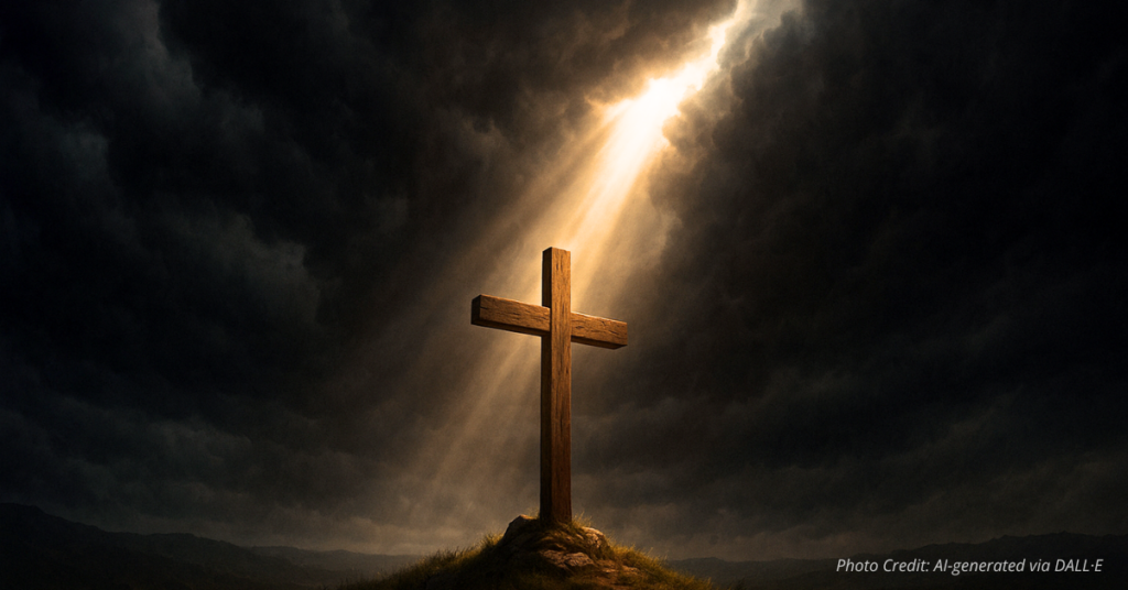 Light shines on a cross through storm clouds