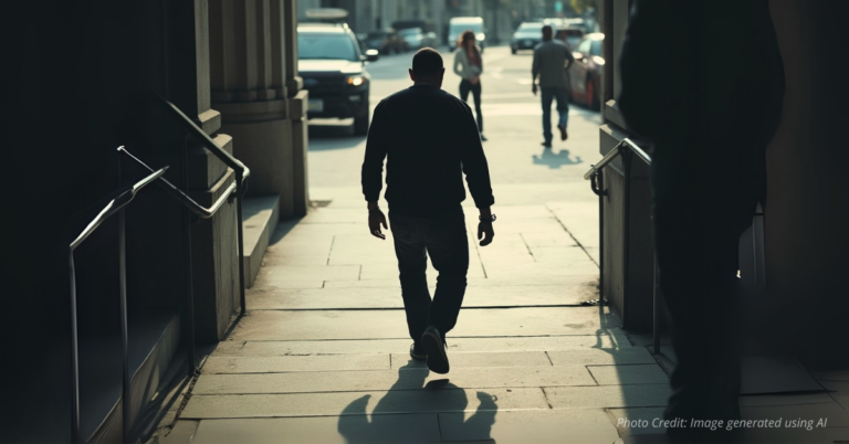 Shadowy figure walking free from courthouse casting long shadow