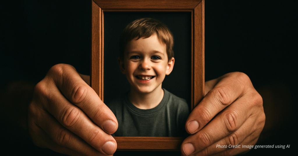 Hands holding photo of child