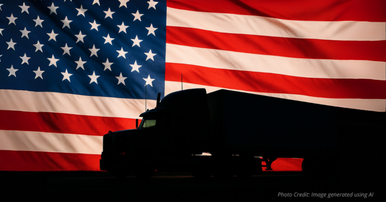 Semi-truck silhouette with American flag background
