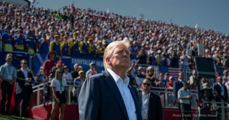 Donald Trump looks over a cheering crowd.