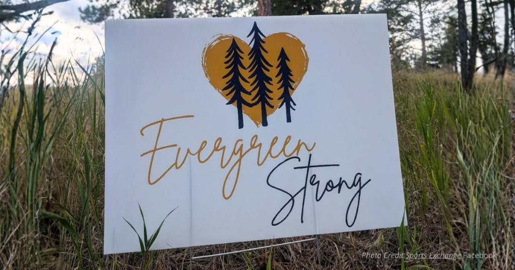 Evergreen strong sign on the side of the road.