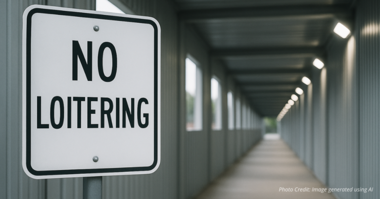 No Loitering sign in front of a cleaned pedestrian tunnel in Lakewood