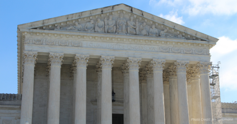 Supreme Court building with Equal Justice Under Law engraving, captured on a clear day