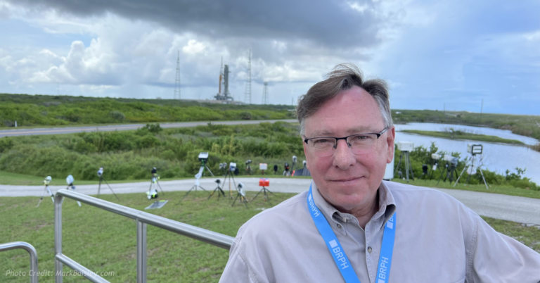 Mark Baisley during a national security site visit highlighting his background in technology and intelligence