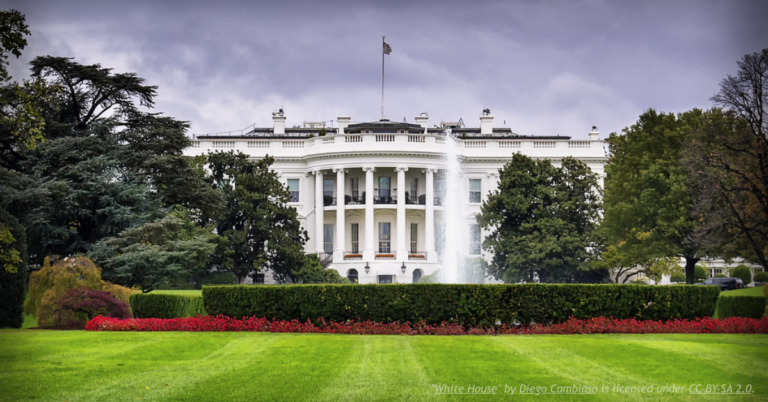 White House surrounded by gardens and fountain