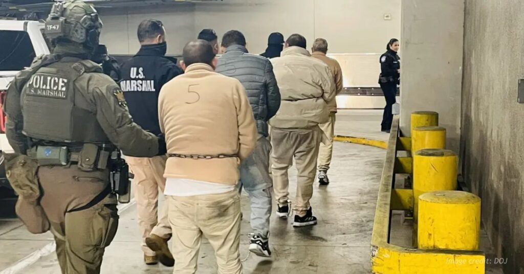 Cartel members escorted by U.S. Marshals.