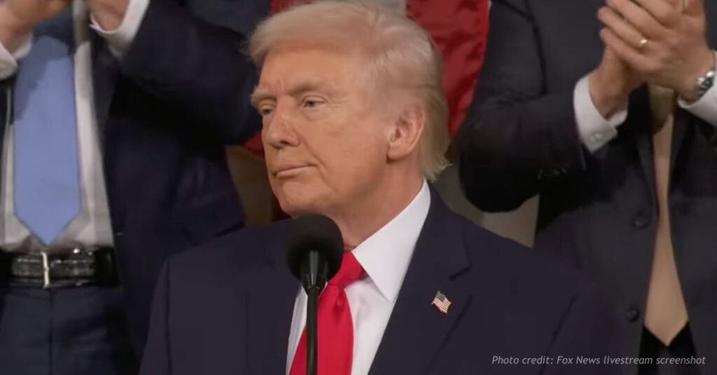 President Trump pauses as Republicans stand and applaud during State of the Union