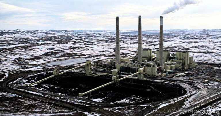 Craig Station coal power plant in northwest Colorado with one smokestack emitting steam in winter landscape