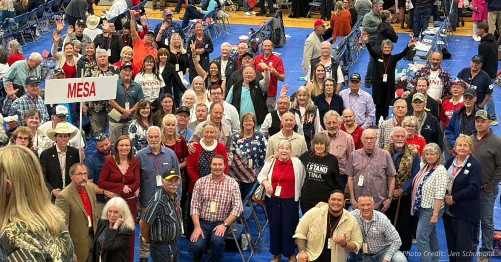 Mesa County Republican delegates gather for a group photo on the convention floor at the Colorado GOP assembly in Pueblo